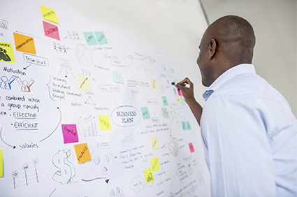 Male Sudent at whiteboard - iStock_000075782383 image