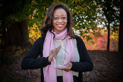 asmine Scott holds the 1st place trophy from the North Carolina Farm Bureau.