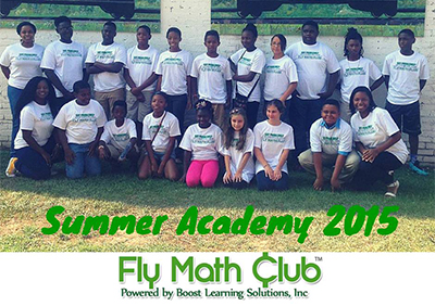 Candice Wilson-McCain ’03, with math middle school-aged students 