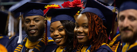 A&T graduates enjoy a moment at the year-ending Fall Commencement, where approximately 960 students were awarded their degrees.