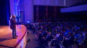 Shark Tank star and entrepreneur Daymond John speaks to a standing-room only crowd as part of his 